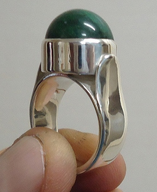 Green jasper set in silver ring demonstrating visible structural elements. Green jasper ring 02 cropped.png