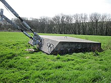 Concrete dead man anchor for radio tower guy lines in Britain Guyed mast anchor.JPG