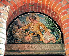 A mosaic on the entrance of a Church in Denmark depicting the Good Shepherd protecting a lamb from a wolf Immanuelskirken Copenhagen mosaic.jpg