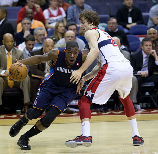 Adrien (left) with the Bobcats in March 2013