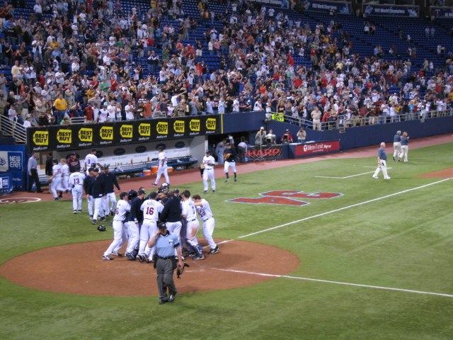 Players of the Minnesota Twins celebrate Justin Morneau's Walk-off home run in victory against the Baltimore Orioles, June 11.