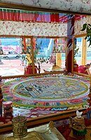 Kalachakra mandala in a special glass pavilion. Buddhist pilgrims bypass the pavilion in a clockwise direction three times.Buryatiya, July 16, 2019
