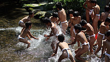 Shinto purification rite after a ceremonial children's sumo tournament at the Kamigamo Jinja in Kyoto Karasuzumo purification ritual.jpg