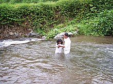 A young man baptizing a child into the LDS Church in Panama LDS Baptism Panama.JPG