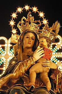 The simulacrum of Madonna of the Miracles during a traditional procession.