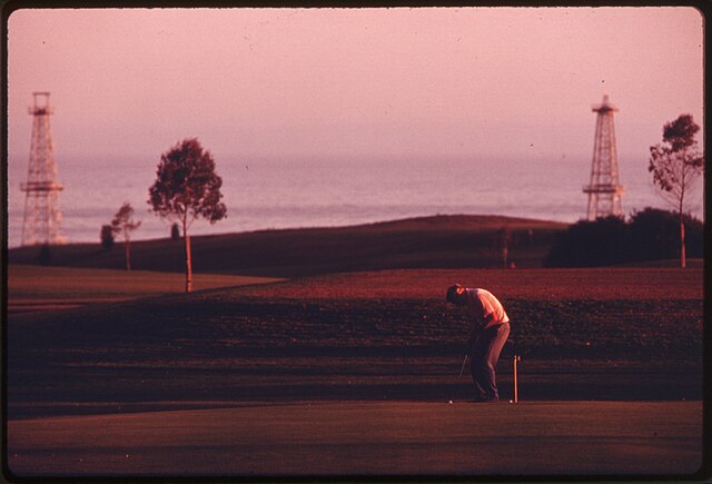 Sandpiper Golf Course with derricks in background, 1975. Photo by Charles O'Rear.
