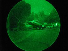 A simple crosshair reticle can be seen on the photo taken through a surveillance AN/PVS-4. The image was taken during a wide-area blackout on a moonless night in a remote suburban area. PVS-4-Crosshair.jpg