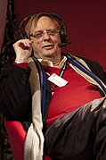 Peter Goers reclining at a live outdoor radio broadcast.