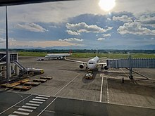 An Airbus A321 of Philippine Airlines (PAL Express) and A320 of Cebu Pacific at the apron. Philippine Airlines A321-231 (RP-C9924) and Cebu Pacific A320-214 (RP-C4104) at Iloilo International Airport 2022-07-07.jpg