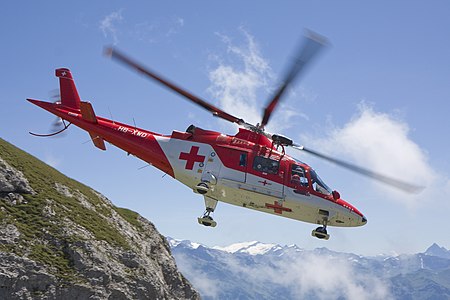 A rescue helicopter type Agusta A109K2 leaves Mount Pilatus after recovering a patient