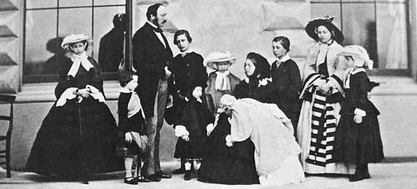 Albert, Victoria and their nine children, 1857. Left to right: Alice, Arthur, Prince Albert, Albert Edward, Leopold, Louise, Queen Victoria with Beatrice, Alfred, Victoria and Helena. Queen Victoria Prince Albert and their nine children.JPG