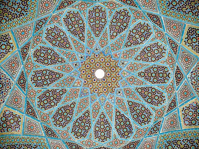 Complex girih patterns with 16-, 10- and 8-point stars at different scales in ceiling of the Tomb of Hafez in Shiraz, 1935