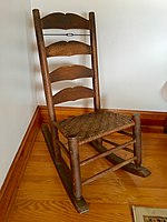 A sewing rocking chair made by Christopher Columbus Stottlemyer, displaying the characteristic scalloped back slats. Stottlemyer Sewing Rocking Chair.jpg
