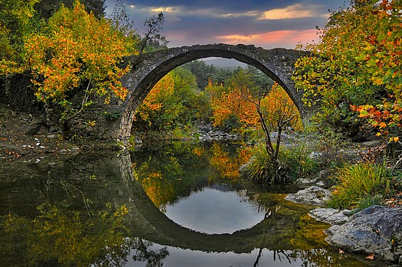 Sunset colors and reflection of Old Stone Bridge near Balıkesir User:Basriseckin