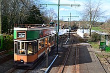 The tram stop at Colyford, with the level crossing beyond