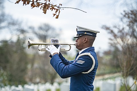 Coast Guard bugler playing the last post