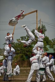 Kyukpa, the Taekwondo breaking techniques, focusing on complex aerial acrobatics and flying kicks USMC-120215-M-SR181-119.jpg