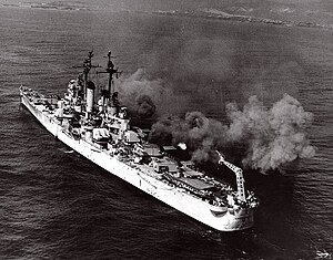 USS Springfield (CL-66) fires her 6"/47 and 5"/38 guns, during gunnery practice in the Pacific, circa 1947-1948.