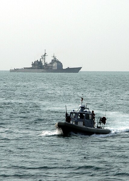 File:US Navy 061024-N-2651J-021 A Rigid Hull Inflatable Boat from the amphibious assault ship USS Saipan (LHA 2), patrols the Gulf within sight of the guided missile cruiser USS Philippine Sea (CG 58).jpg