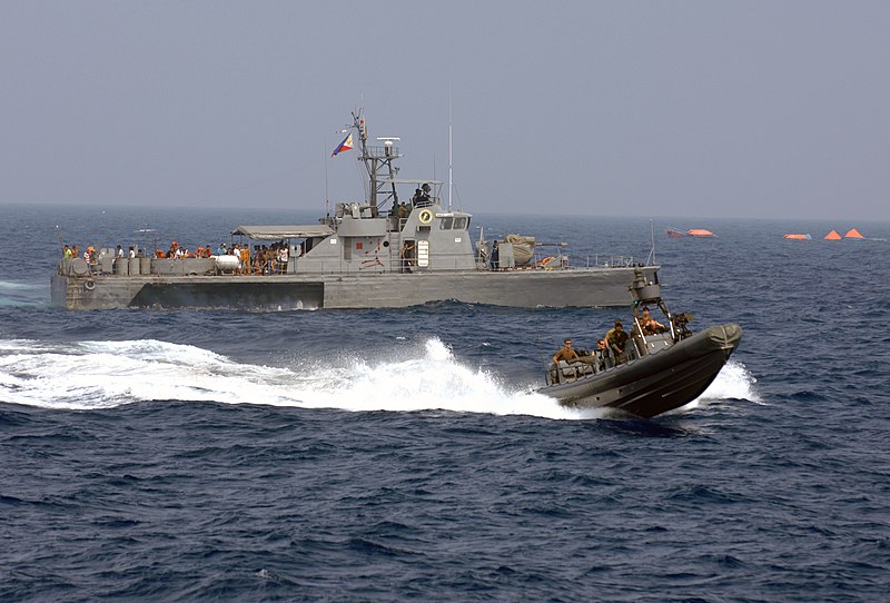 File:US Navy 090906-N-0120R-068 A Philippine Navy patrol boat and an 11-meter rigid hull inflatable boat operated by members of Joint Special Operations Task Force-Philippines (JSOTF-P) search for survivors Sept. 6, 2009.jpg