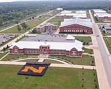 A 2011 aerial view of some of the recruit training facilities constructed during the recapitalization of RTC that followed BRAC 1993. US Navy 110820-N-IK959-452 Sailors form a blue and gold 'N'.jpg