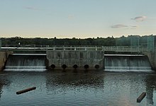 Waterfall stemming from Lake Manalapan in Jamesburg. It was dammed by the Buckelew family in 1911 Waterfall stemming from Lake Manalapan.jpg