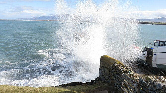 Wave on pier, Co. Kerry, Ireland.