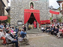 People prepare for a Saint John's Day procession and church service in the comune of Esino Lario, Italy. Wikimania 2016, Esino Lario, Italy - 02.jpg