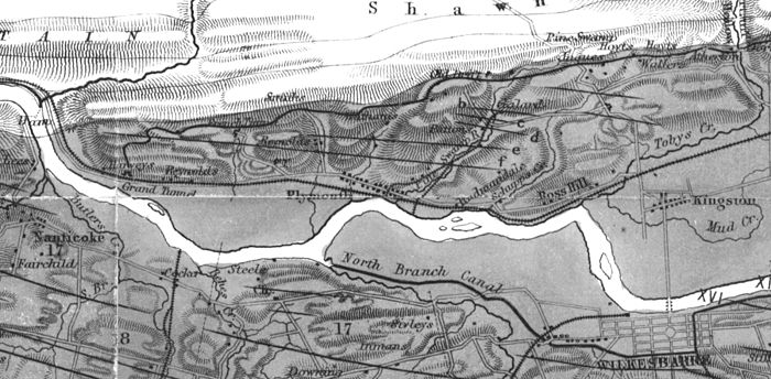 The Anthracite Coal Fields map illustrates the mine operations in Plymouth in 1858, after the Lackawanna & Bloomsburg Railroad came to Plymouth. The extent of the great coal basin is shown in dark grey, and indicates the great bounty of anthracite coal below Plymouth's surface. 1858 Anthracite Map Detail.jpg