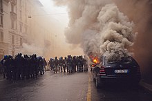 Smoky fire on a city street during a demonstration