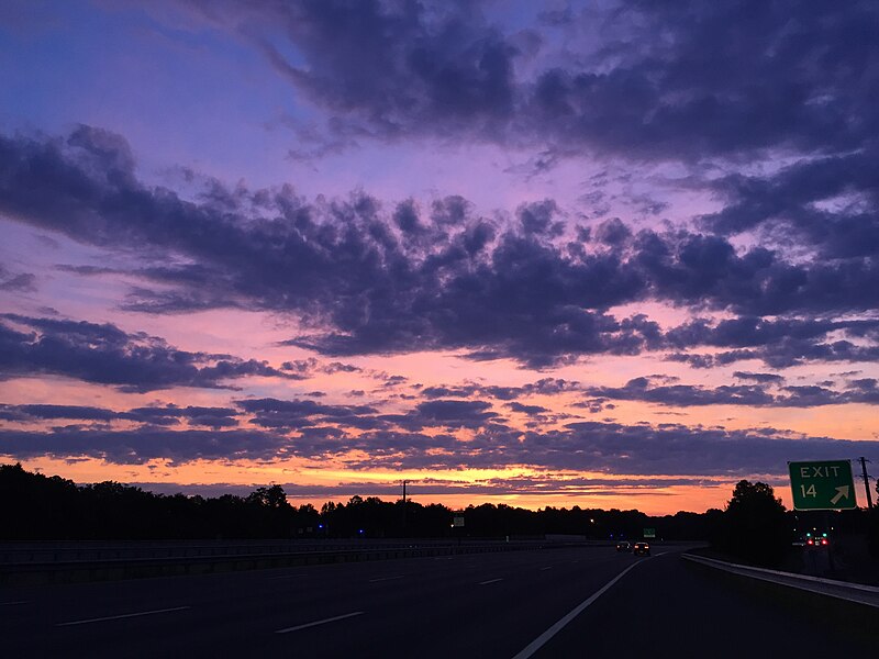 File:2016-07-12 05 38 14 Sunrise along the eastbound Dulles Toll Road (Virginia State Route 267) at Exit 14 (Hunter Mill Road) in Reston, Fairfax County, Virginia.jpg