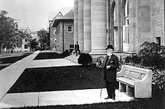 c. about 1915 - Standing near his statue on the Cornell campus