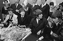 Holding a press conference in the Netherlands at the start of their first world tour, June 1964 Aankomst Beatles op Schiphol, de Beatles tijdens persconferentie. Vlnr Jimmy Nic, Bestanddeelnr 916-5130.jpg