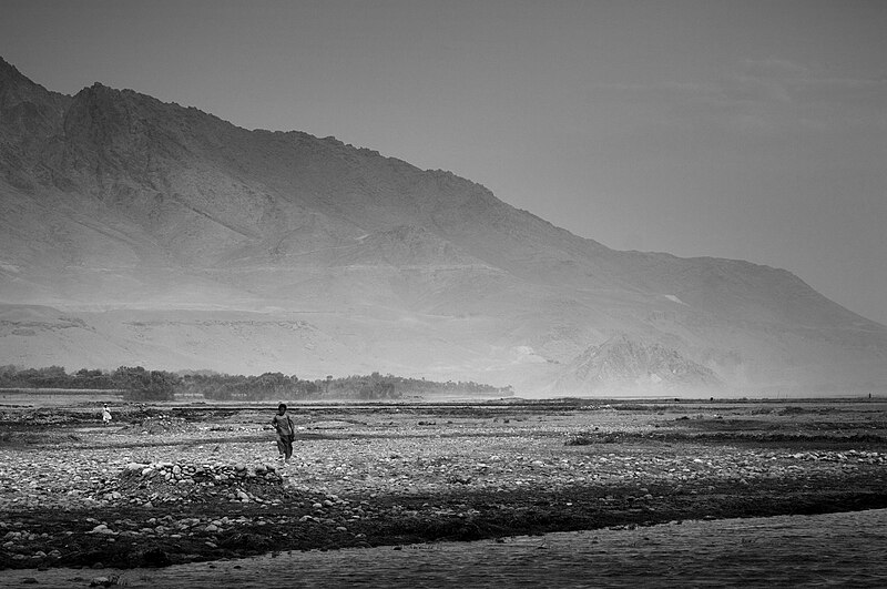 File:Afghans walk across a river valley in Kapisa Province.jpg