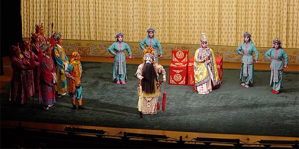 The Hegemon-King Bids His Concubine Farewell, one piece of classical Peking opera. The woman, Consort Yu, deeply loved the King Xiang Yu (middle of th