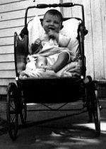 A baby in a buggy, USA, 1935