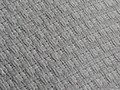 Closeup of gold weave pattern on an OTM blank white gi.