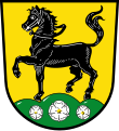 Gemeinde Großwalbur In Gold ein schreitendes schwarzes Pferd mit schwarzem Zügel auf grünem Berg, der mit drei silbernen heraldischen Rosen belegt ist.[3]
