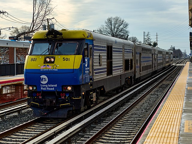 DM30AC 501 primarily diesel locomotive operating in electric locomotive mode from a third rail at New Hyde Park, USA