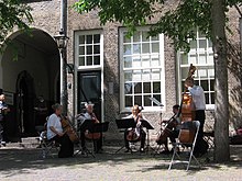 An unusual string quintet (De Zagerij Pro) consisting of four cellos and a double bass, Hof, Dordrecht, the Netherlands, 2019 De Zagerij Pro (vier cello's en een contrabas) in het Hof, Dordrecht, 2019.jpg