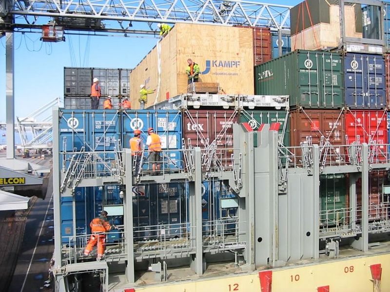 File:Dockworker team on a container ship.jpg