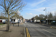 Main Street, looking east along the B7081 from the B730 crossroads Dreghorn Main St.jpg