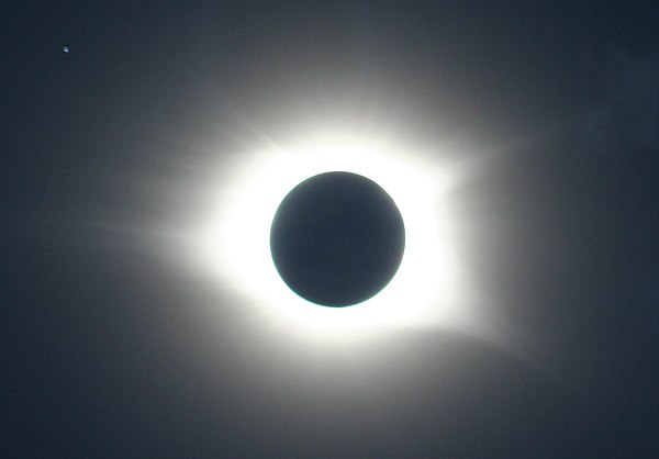 Solar eclipse and star system Regulus (upper left) viewed from Cullowhee, North Carolina