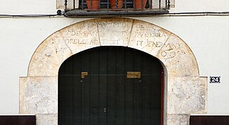 Inscription (1769) above the entrance to Hotel Canaleta in Espolla, Spain.