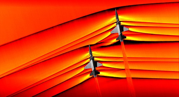 The interaction of shock waves from two supersonic aircraft, photographed for the first time by NASA using the Schlieren method in 2019.