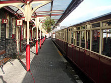 A Ffestiniog Railway train at Porthmadog Harbour railway station FR PHS Platform.jpg