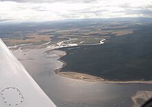 Aerial photo of Findhorn Bay, with the east end of the Culbin Forest at right and the estuary of the River Findhorn at centre. Findhorn Bay.jpg