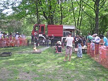 Firefighters teaching a class of young students about how to properly use a fire extinguisher Fire-extinguisher-child-lesson-Tuzoltonap-2013.JPG