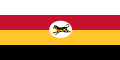 Flag of four stripes along the fly coloured white, red, yellow and black respectively. In the middle is a white oblong circle with a Malayan tiger in it.
