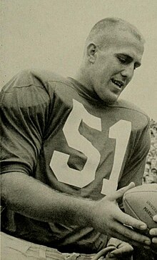 Gene Alderton in a Detroit Lions uniform with a football in his hand.